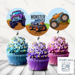 May include: Three cupcakes with blue, purple, and pink frosting, topped with yellow sprinkles. Each cupcake has a circular topper with a monster truck design. The center topper reads "MONSTER TRUCK".