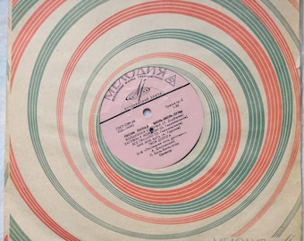 May include: A vintage vinyl record sleeve with a red and green concentric circle pattern. The label features the text "Мелодия" in a stylized font, along with the title "ПЕСНИ ПОЛАЯ БЮЛЬ-БЮЛЬ-Оглы" and a list of song titles.