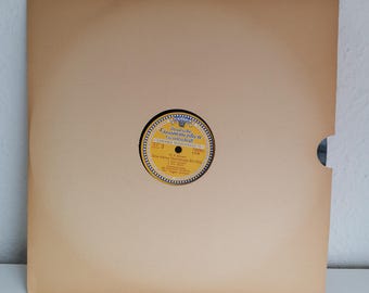May include: A yellow and black record label with the text "Deutsches Grammophon Gesellschaft" and "Walzer-Melodien 17209/10  LYM" in German. The label is on a brown paper record sleeve.