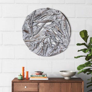 May include: Whitewashed driftwood wall decor in a circular shape. The driftwood is arranged in a random pattern, creating a unique and natural look.