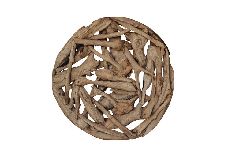 May include: A round wall decor made of natural driftwood branches, arranged in a circular pattern. The branches are light brown in color and have a rustic, natural look.