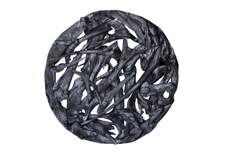 May include: A circular wall decor made of interwoven driftwood branches, painted black. The branches are arranged in a random pattern, creating a unique and organic design.
