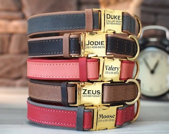 May include: Five leather dog collars stacked on top of each other. Each collar has a gold metal buckle with a personalized name tag. The name tags read "Duke, Call My Mom, 321-654-4532", "Jodie, 321-456-9874", "Valery, 321-634-8355", "Zeus, 123-987-6547", and "Moose, 231-659-7815".