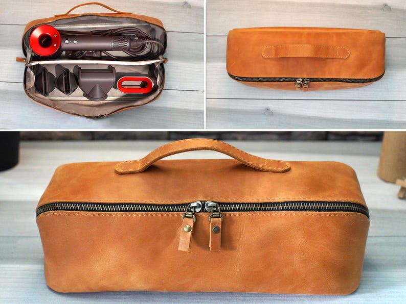 May include: A tan leather travel case with a black zipper and a handle. The case is open, revealing a hair dryer and attachments. The hair dryer has a red accent. The case is closed in other images.