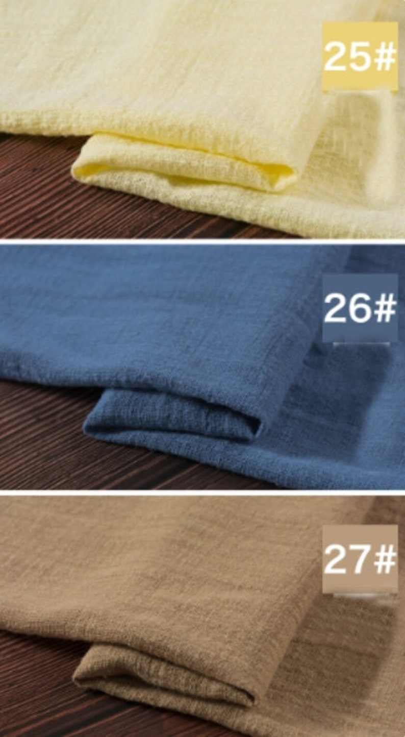 May include: Three fabric swatches in different colors: a pale yellow, a medium blue, and a light brown. Each swatch is folded in half and labeled with a number: 25#, 26#, and 27#.