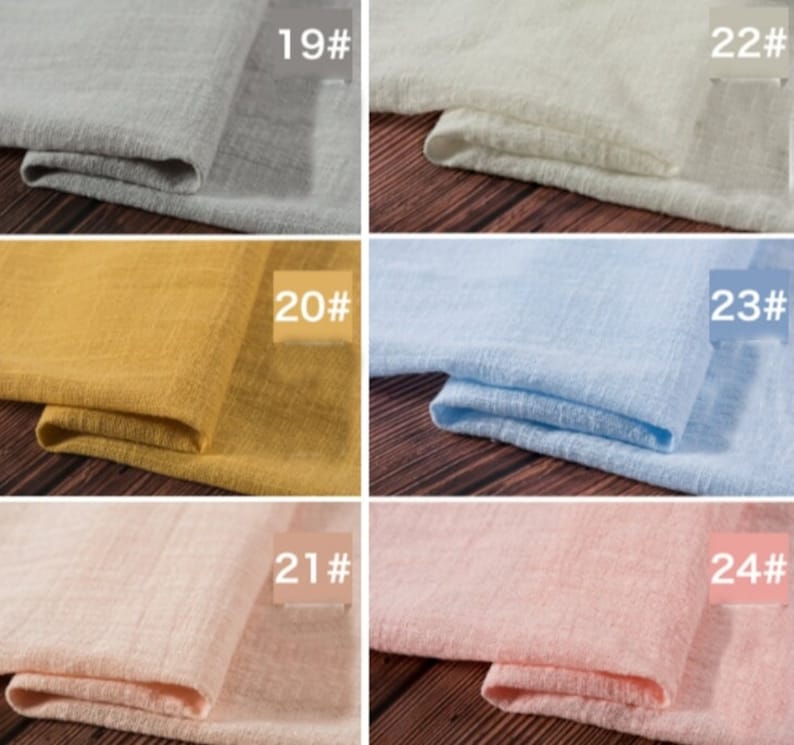 May include: Six fabric swatches in different colors, including gray, white, yellow, light blue, pink, and peach. Each swatch is folded in half and labeled with a number from 19 to 24.