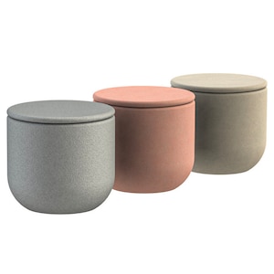 May include: Three round ceramic containers with lids. The containers are in grey, pink, and beige.