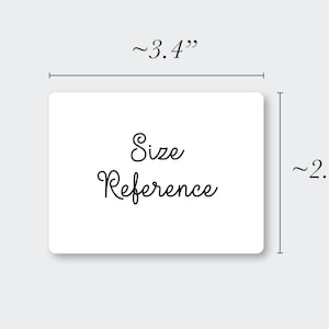 May include: A white rectangular card with the words "Size Reference" in black script. The card measures approximately 3.4 inches wide and 2.3 inches high. The card is on a light gray background.