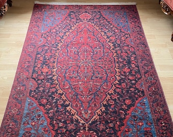 May include: A red, blue, and cream colored Persian rug with a floral pattern. The rug has a white fringe border.