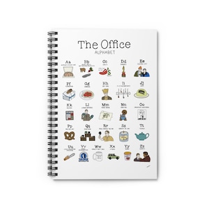 May include: Spiral-bound notebook featuring "The Office Alphabet" with illustrations for each letter. The cover displays the title in black font. The notebook's design includes images of pizza, Dundie Awards, and other show references.