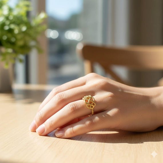 A gold filigree ring with a secret hidden compartment — the 'poison ring' concept is genuinely intriguing and conversation-starting wearable history.