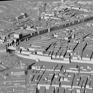 Op de afbeelding: Een 3D-model van een stad met gebouwen en straten. Het model is gemaakt van grijs plastic en is ontworpen om eruit te zien als een echte stad.