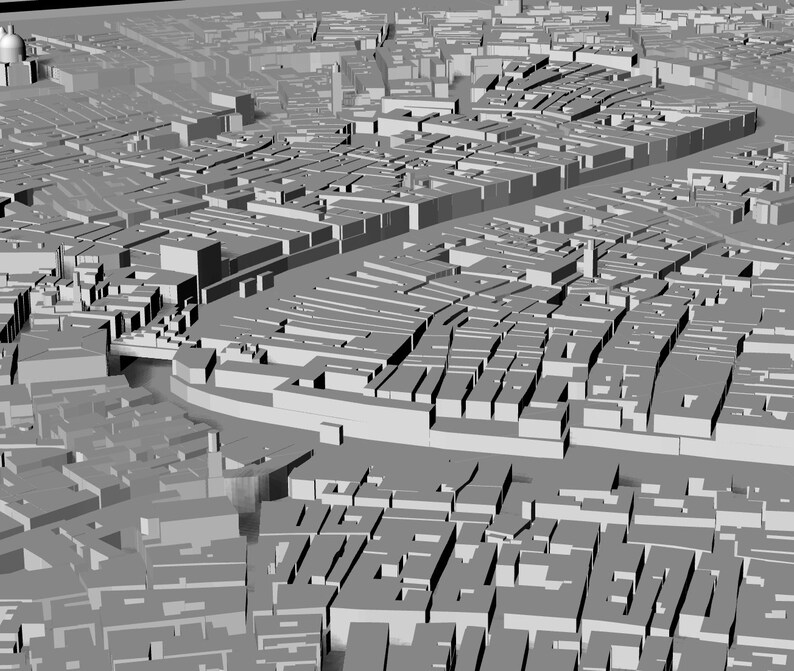 Op de afbeelding: Een 3D-model van een stad met gebouwen en straten. Het model is gemaakt van grijs plastic en is ontworpen om eruit te zien als een echte stad.