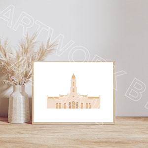 Puede incluir: Una impresión enmarcada con una ilustración minimalista de un edificio con una torre central y una cúpula dorada. La obra de arte está en tonos beige y dorado, sobre un fondo blanco. Un jarrón con hierba de la pampa seca está a la izquierda.
