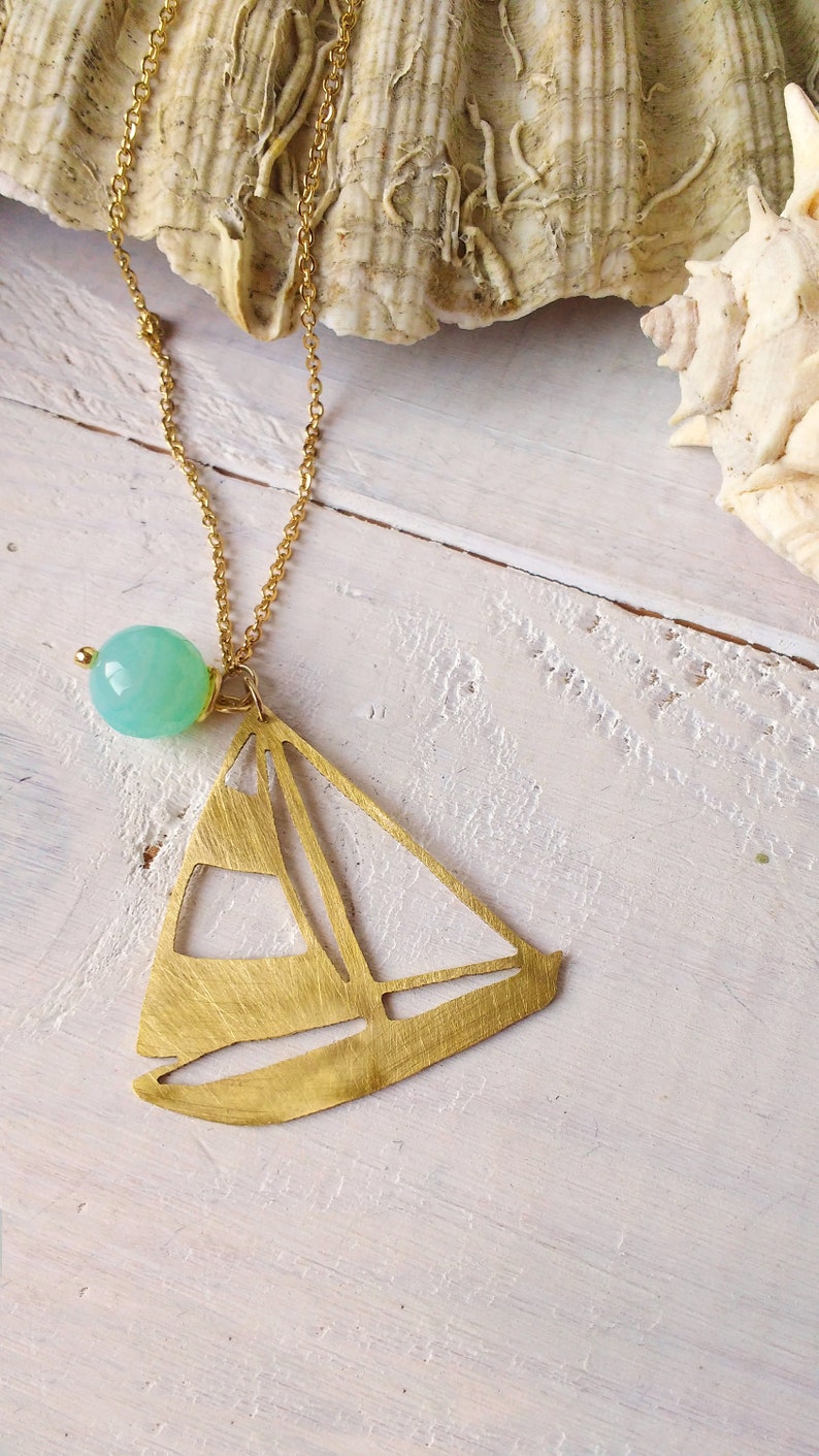 long necklace with steel chain and brass pendant in the shape of a sailboat handmade