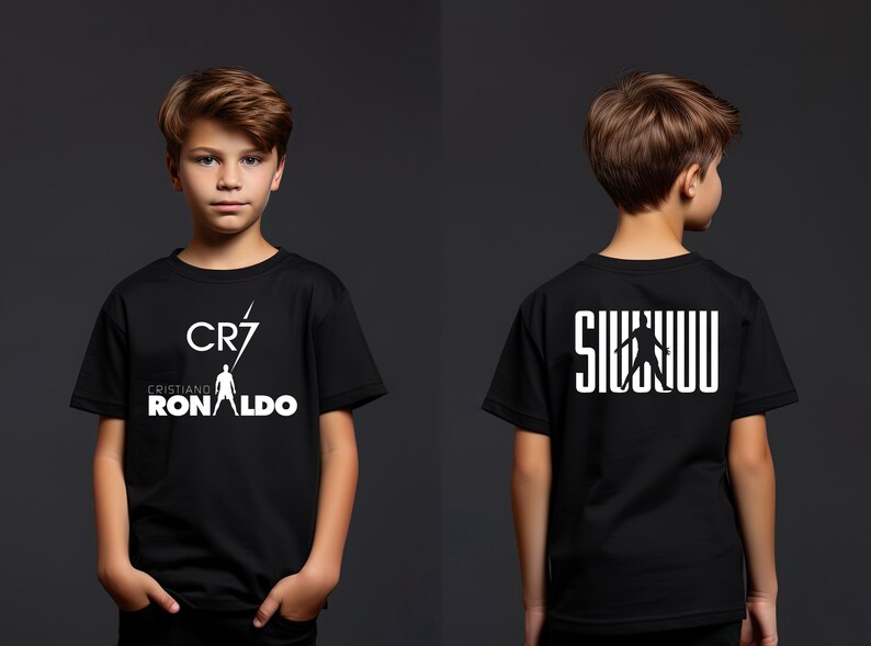 a young boy wearing a black shirt with white letters on it