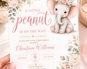 May include: A rectangular baby shower invitation card featuring a watercolour illustration of a baby elephant wearing a pink floral crown, surrounded by pink roses and greenery. The text reads A LITTLE peanut IS ON THE WAY! Christina Williams, May 9, 2026, at 3:00 PM, and includes address and RSVP details.