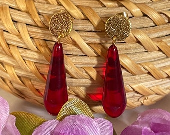Freezing earrings with long red drops
