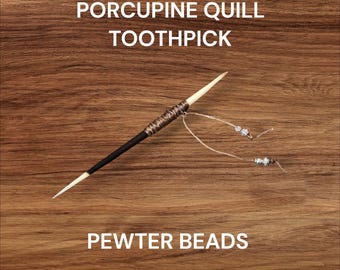 Porcupine Quill Cowboy Toothpick with Sinew and Pewter Beads. Approximately 7 inches long.