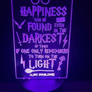May include: Purple LED light with a quote from Albus Dumbledore: "Happiness can be found even in the darkest of times if one only remembers to turn on the light."