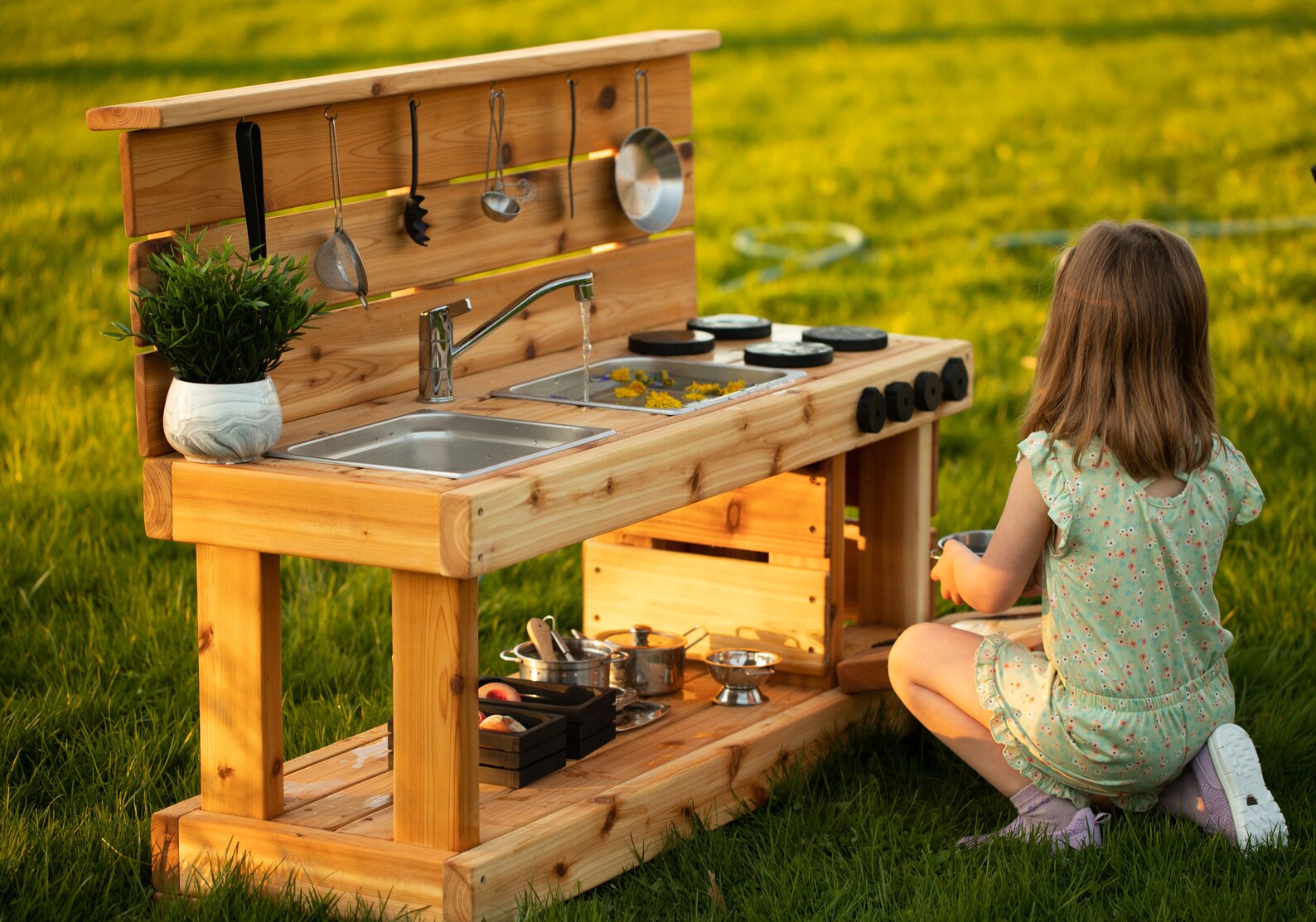mud kitchen with working sink