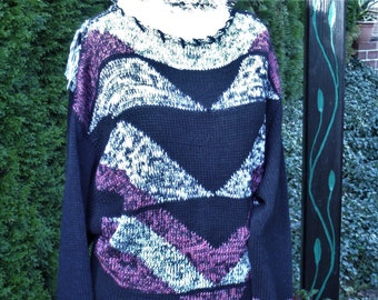 Intarsia sweater with fringed insert at the back