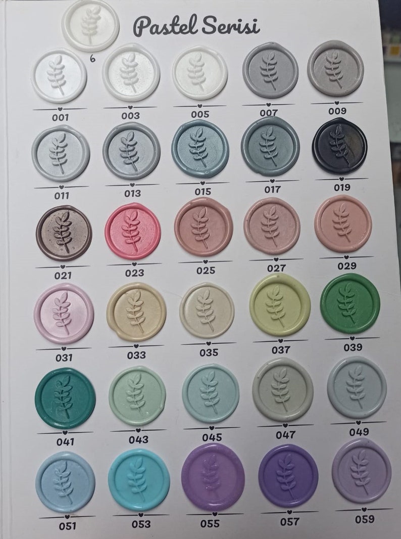 May include: A color chart of 50 wax seal stamps with a leaf design. The chart is labeled "Pastel Serisi" and each stamp is numbered from 001 to 059.