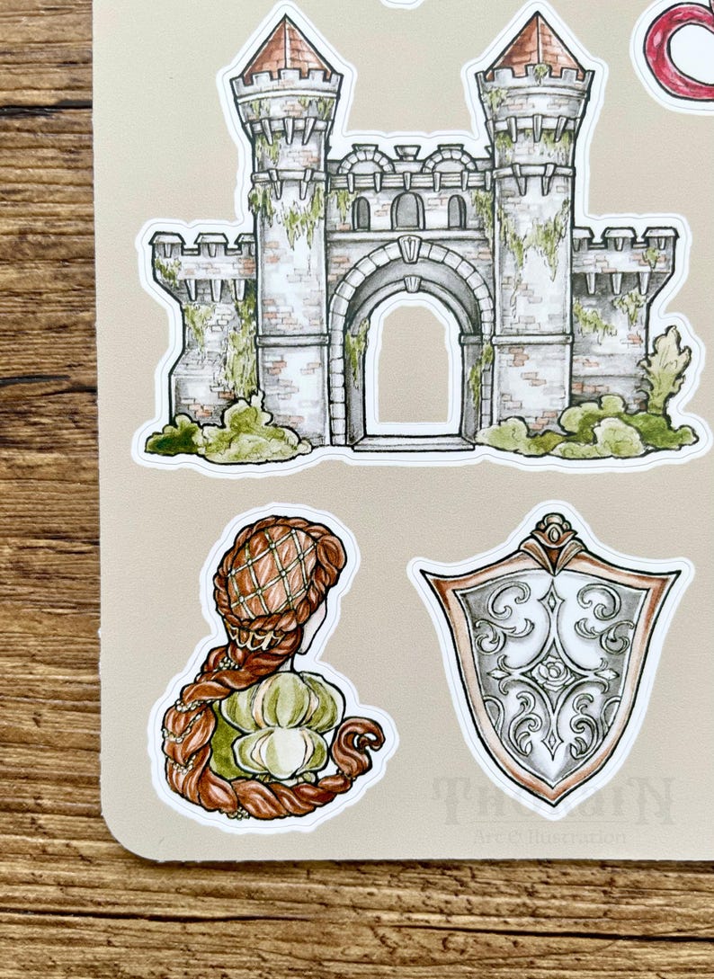 May include: A set of stickers featuring a stone castle with a large archway, a woman with long braided hair, and a silver shield with ornate designs.