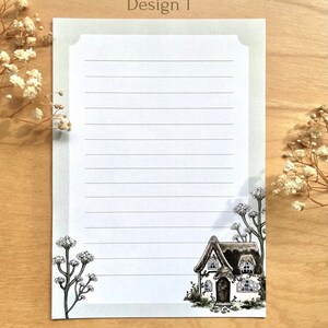 May include: A white cottage with a brown roof and a green door is drawn on a white sheet of paper with green borders. The paper has lines for writing. The image is labeled "Design 1" at the top and "ThorarN Art & Illustration" at the bottom.