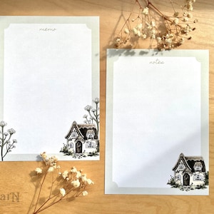 May include: Two blank stationery note cards with a cottage illustration and the words "memo" and "notes" at the top. The cards have a light gray border.