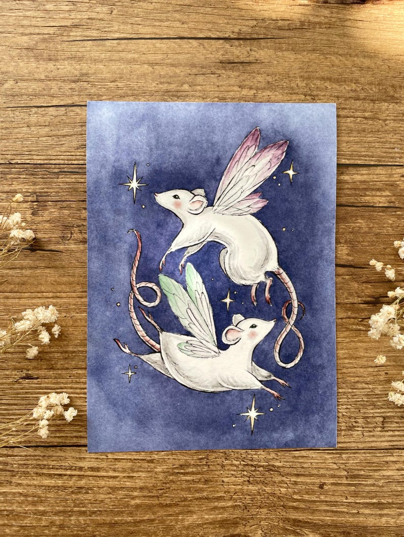 May include: Watercolor illustration of two white mice with fairy wings, floating against a dark blue background. The mice have long tails and are surrounded by sparkling stars. The wings are a mix of pink and green.