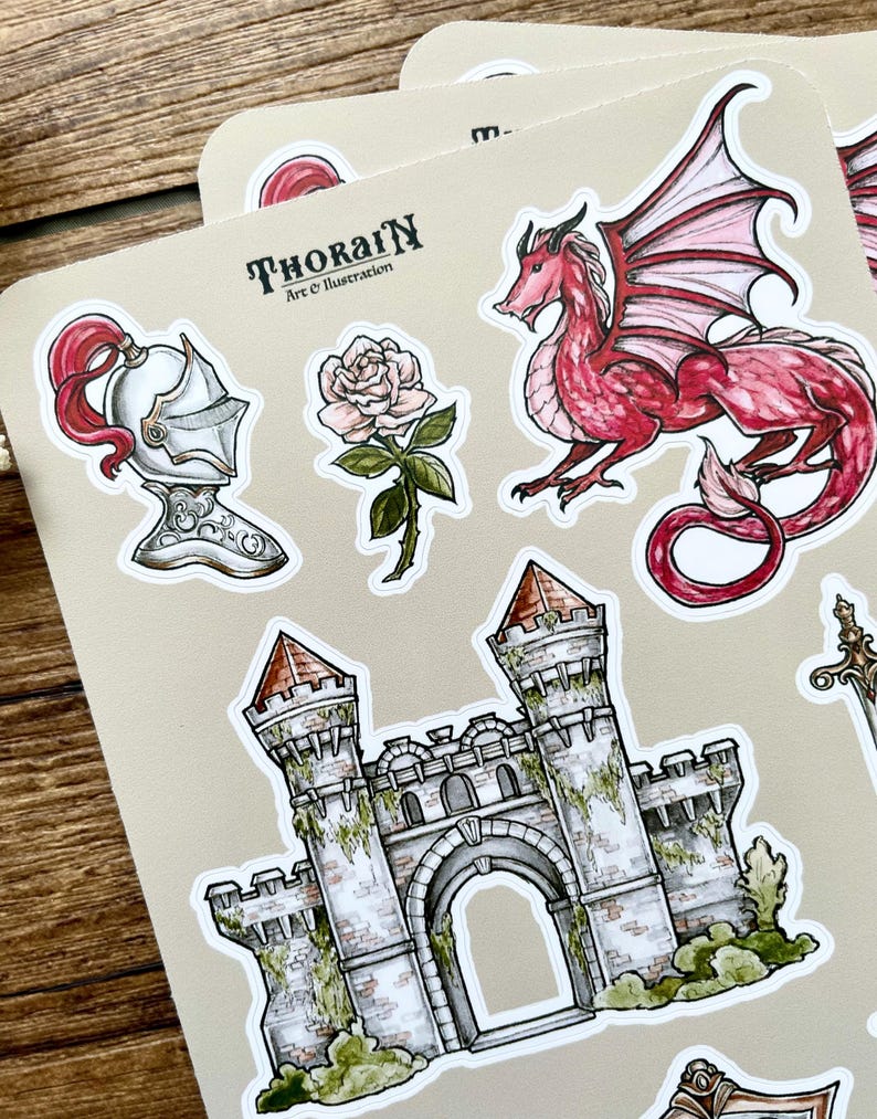 May include: A set of stickers featuring a red dragon, a white rose, a knight's helmet, a stone castle, and the text "THORAIN Art & Illustration".
