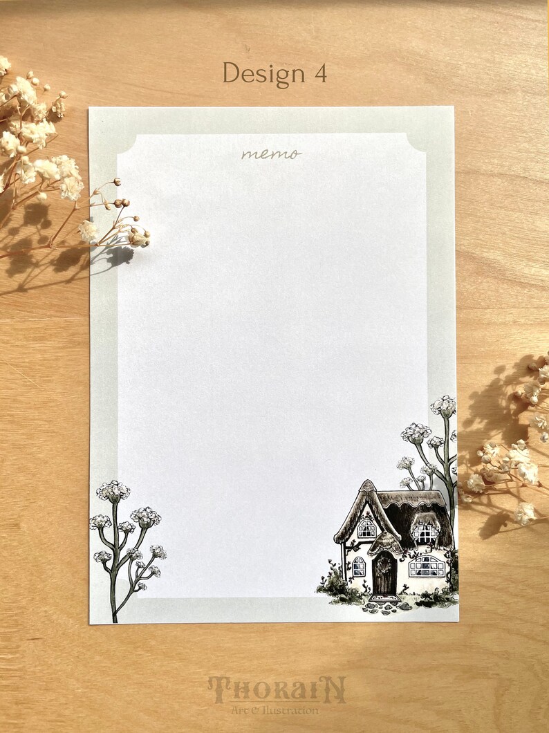 May include: A printable memo pad design featuring a black and white illustration of a cottage with a thatched roof and a small garden. The text "memo" is written at the top of the page.