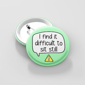 May include: A green button with a white speech bubble that says "I find it difficult to sit still" and a yellow warning sign with an exclamation point.