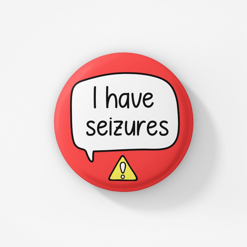 May include: Red button with a white speech bubble that says "I have seizures" and a yellow warning sign with an exclamation point.
