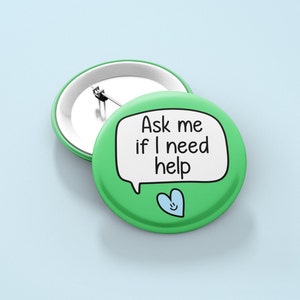 May include: Green button with a white speech bubble that says "Ask me if I need help". A blue heart with a smiley face is below the speech bubble.