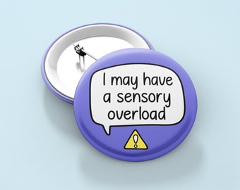 May include: Purple button with a white speech bubble that says "I may have a sensory overload" with a yellow exclamation point in a triangle.