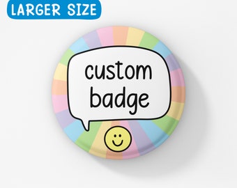 May include: A round, colorful button with a rainbow design. The button has a white speech bubble with the text "custom badge" and a yellow smiley face.