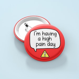 May include: Red button with a white speech bubble that says "I'm having a high pain day". There is a yellow warning sign with an exclamation point inside the speech bubble.