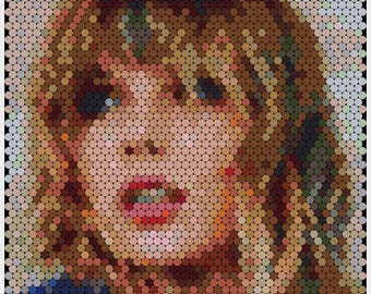 May include: A close-up of a woman's face, rendered in a pixelated style using small, colourful circles. The woman has brown hair, fair skin, and is wearing a blue shirt.