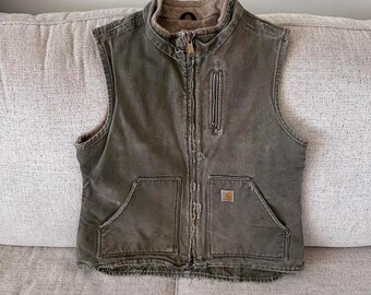 Chaleco Carhartt MOS verde vintage para mujer, talla M, con efecto desgastado y desteñido.