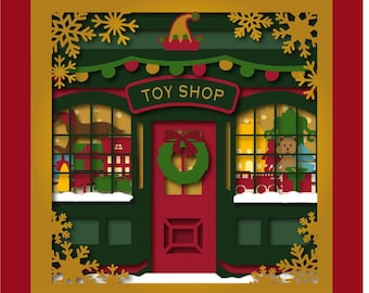 Modèle Shadow Box 10 x 10 po du magasin de jouets de Noël. Un cadeau artisanal parfait pour les fêtes ou une décoration intérieure. Peut être fabriqué avec ou sans rétroéclairage.