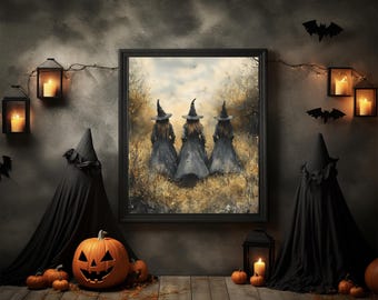 May include: A framed print depicts three witches in black dresses and hats walking through a field. The Halloween-themed scene is decorated with pumpkins, candles in lanterns, and bat silhouettes. The artwork is set against a dark gray wall.
