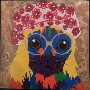 May include: A colorful painting of a cat wearing a white hat with red flowers and round glasses. The cat has yellow hair and a purple, blue, green, and orange body.