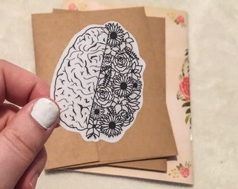 Brianflower, black/white outline, Brain decorated with Flowers Die Cut Sticker, mental health awareness, Brainflower