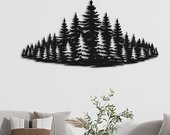 May include: Black metal wall art depicting a silhouette of a forest with pine trees. The art is mounted on a white wall above a white couch with throw pillows and a coffee table.