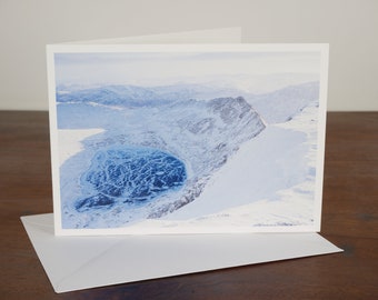 Striding Edge and frozen Red Tarn from Helvellyn summit, Lake District