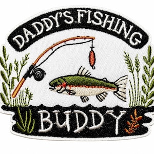 May include: An embroidered patch featuring a fishing theme with a green and white fish, a fishing rod, and green reeds. The text DADDY'S FISHING is arched at the top in white on a black background, and the word BUDDY is at the bottom in white.