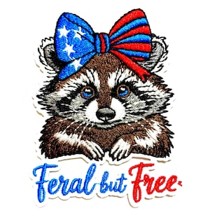 May include: Embroidered patch featuring a raccoon with a patriotic bow. The bow is blue with white stars and red and blue stripes. The text "Feral but Free" is below the raccoon in blue and red.