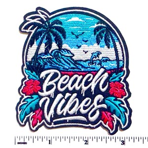 May include: Embroidered patch with a beach scene featuring palm trees, waves, and the text "Beach Vibes" in white script. The patch has a blue, red, and white color scheme, with a black border and measures approximately 3 inches wide.